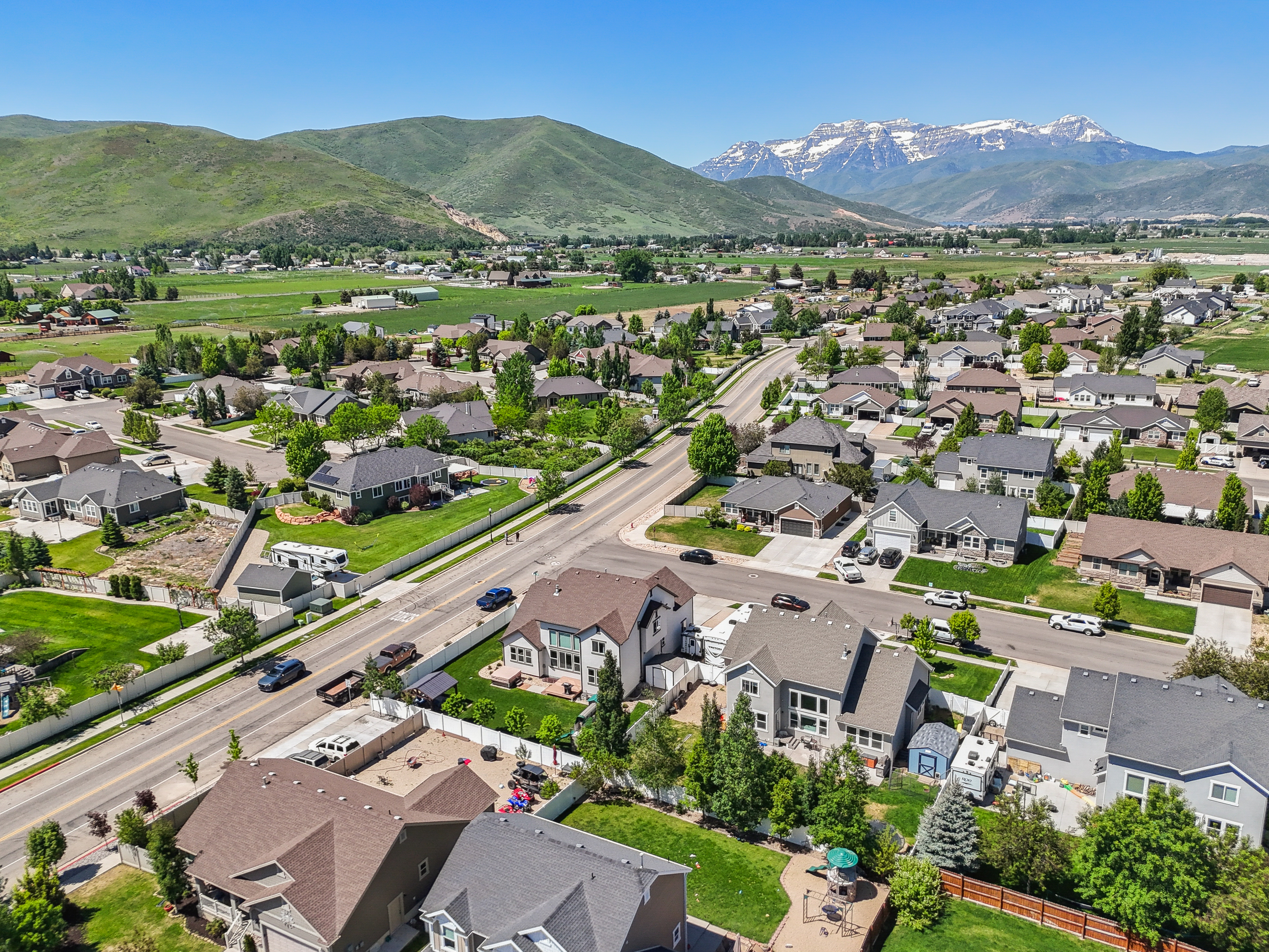 Aerial view of Wheeler Park neighborhood in Heber City Utah with single-family homes and Mount Timpanogos in the background